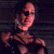 Pixelated image of a person with dark hair and sunglasses on the left, next to green text reading Original Icons .com on a solid background.