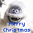 Pixelated cartoon character with wide eyes and open mouth, wearing white head covering, overlaid with blue text reading "Merry Christmas" on white background.