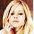Pixelated image of a person with blonde hair and hand near face, surrounded by pink text reading 'Kiss Me', 'And I Promise You...', 'You Won't Regret It' on white background.