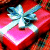 Red gift box with silver bow on left, green background with 'Original Icons .com' text on right.