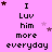 Pixelated text on pink background with scattered stars, displaying "I Luv him more everyday" in repeating and