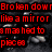 Red text fragments on a dark, textured background with scattered light reflections.