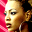 Pixelated close-up of a person's face with red background, visible ear and neck area, static single-frame image.