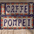 Static pixel art image with two lines of stylized text on a patterned background featuring red, green, and blue elements.