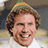 A pixelated image of a smiling person with curly hair wearing a striped hat, next to red text on green background reading 'smiling is my favorite!!!!'