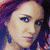 A pixelated image of a person with red hair wearing a red headband and a pink floral-patterned top, with the text 'katy5' overlaid in bold white letters with a black outline.