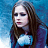Pixelated image of a person with long brown hair wearing a blue top against a blue gradient background.