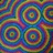 A static pixelated image featuring four concentric spiral patterns in a grid layout, with color gradients transitioning through blue, green, yellow, and purple hues.