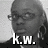 Black-and-white pixelated image of a person's face with glasses and short hair, overlaid with large white text reading "k.w." at the bottom.