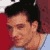 Static 50x50 pixel icon showing a close-up of a person's face with dark hair and light skin, set against red and blue background elements.