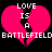 Pixelated pink broken heart with white text 'LOVE IS A BATTLEFIELD' on black background, two identical heart halves side-by-side.