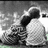 A static image with two : top shows a grayscale couple embracing, bottom displays red text and hands holding an apple