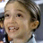 A 48x48 pixel buddy icon featuring a close-up of a smiling person with short hair on the left and blue text reading "jersey girl" on the right, displayed as part of an animated contact sheet.