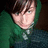 Pixelated image of a person in green hoodie on left, green background with 'I Love You' text on right.