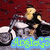 A pixelated image of a person riding a motorcycle with a blue text overlay reading 'AngieG3' on a red background.