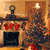 Pixelated holiday scene with fireplace, stockings, Christmas tree, and snowman in blue tones.