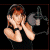 Pixelated image of a person holding a camera with both hands, positioned to the left of bold red text reading JUDE on a black background.