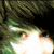 Pixelated close-up of a person's face with green and brown hair, visible eye, and bright white light effect on the lower portion.