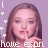 A pixelated image of a person with long brown hair holding a finger to lips, surrounded by white and red heart symbols and partial text reading 'howe espn' at the bottom.