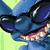 Pixelated blue and green character with dark eyes, pink mouth area, and light-colored accents on a gradient background.