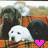 Two pixelated cartoon characters with white and black heads sit side-by-side on a brown surface, each holding a heart-shaped icon.