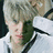 A pixelated image of a person with light hair in the top-left quadrant, adjacent to green and gray sections containing text.