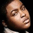 Pixelated image of a person with closed eyes and tilted head, next to white text on black background.