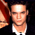six shows a person in dark clothing with white collar against red and black background, text overlays change across frames