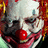 Pixelated clown face with red nose and white makeup, orange text reading 'I'm Being A Freaky Clown For HALLOWEEN!' on black background.