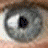 six pixelated images showing a person's eye, face, and name text in varying compositions