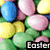 Pixelated image of colorful rounded shapes resembling candies or balloons with green foliage and partial text reading 'Eoyel' at bottom right.