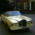 Animated image of a yellow convertible car with blue top, text "Bling Bling" above and "in the" below, and a Rolls-Royce logo on right.