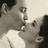 Black-and-white image of two people kissing on left, red background with text on right.