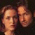 A 50x50 pixel animated buddy icon featuring a contact sheet of two frames showing close-up portraits on the left and green text reading "Original Icons .com" on the right against a dark background.