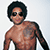 Animated icon shows Lenny Kravitz in two poses: shirtless with tattoos and sunglasses, then in a dark shirt with sunglasses and a thumbs-up gesture.