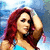 A pixelated image of a woman with long red hair wearing a blue crop top and denim shorts, shown in multiple poses including hand on head and crouching.
