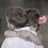 A pixelated image shows a person with brown hair in a white top embracing another figure against a dark background, next to bright cyan text reading 'ily Adam X33333'.