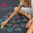 A pixelated image shows a person's legs in a bikini on a patterned surface with a pink heart symbol in the top-left corner.
