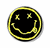 Static circular icon with black background and yellow border featuring a stylized smiley face made of pixelated X's for eyes, curved line for mouth, and stick-figure limbs in motion.