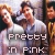Pixelated image of three people in a group pose with overlaid text reading 'Pretty In Pink' in blocky white letters.