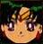 Pixelated cartoon face with large purple eyes, light brown hair, and a small nose on a dark green background.