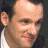 A 48x48 pixel buddy icon featuring a split composition with a partial human face on the left and green text on a dark background on the right, displayed as part of an animated contact sheet.
