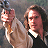 A pixelated figure in period clothing holds a stake, with 'VAN HELSING' text on the right side of the image.