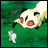 Animated contact sheet showing three frames of a cartoon cat-like character with red cheeks and black ears lying on green grass, interacting with a small white figure that changes position across frames.