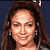 Static pixelated image of a person with long dark hair against a solid blue background, rendered in low-resolution 256x256 pixels with visible dithering and color banding.