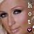 Pixelated close-up of a person's face with visible eyes, nose, and mouth; vertical white text 'hot' on the right side above a pink heart symbol.