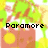 Pixelated image of a red radio with yellow circular speakers, green and white background, displaying text changes across frames.
