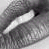 A grayscale animated contact sheet showing two frames of a close-up eye with a white object near the pupil, and a small heart icon in the bottom-right corner of the second frame.