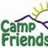 Pixelated image with green 'Camp Friends' text over a white background with a dark roof and yellow tree, surrounded by pink text on black background.