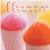 Two stylized mushroom-shaped figures with gradient caps in pink and orange hues, set against a soft pastel background with yellow and peach tones.